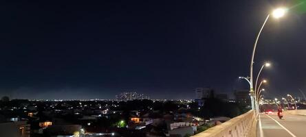 View of houses and buildings at night photo