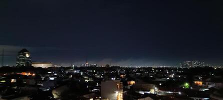 View of houses and buildings at night photo