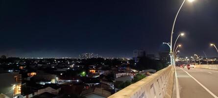 View of houses and buildings at night photo