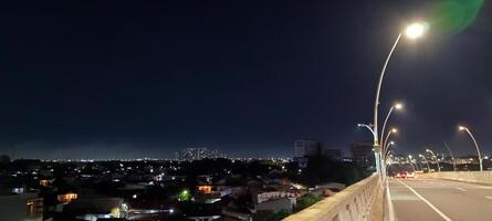 View of houses and buildings at night photo