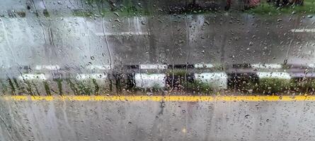 View of the highway from the foggy glass photo