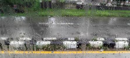 View of the highway from the foggy glass photo