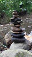 Close up of stacks of rocks on the river bank photo