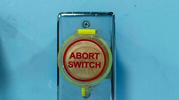 Abort switch sign in the room is used in emergency situations photo