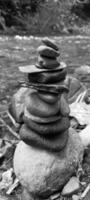 Close up of stacks of rocks on the river bank photo