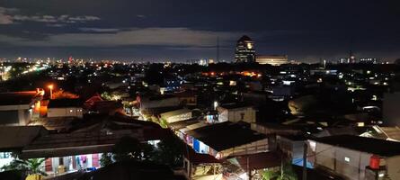 View of houses and buildings at night photo