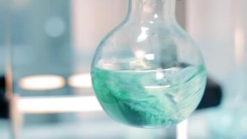 Laboratory Research using Glass Test Tube. Close up of purple Chemical Substance dropping into transparent Container. Concept of Laboratory Experiments and Analysis video