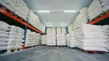Unloading of large white bags from long-term storage of bulk products. video