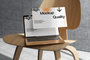 Laptop display mockup with realistic chair and wall background psd