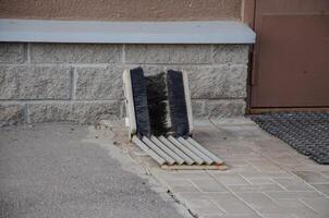 shoe brushes in front of the house on the street. High quality photo