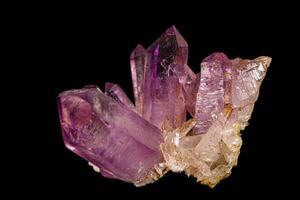 Macro of amethyst mineral stone on black background photo