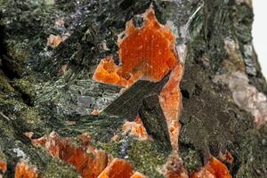 Macro stone mineral Diopside Calcite Magnetite on a white background photo