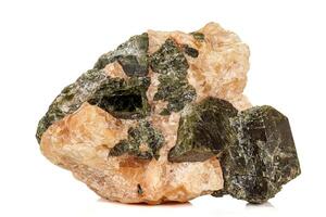 Macro of a mineral stone Vesuvianite on a white background photo