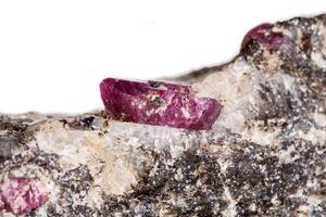 Macro of a mineral Ruby stone on a white background photo