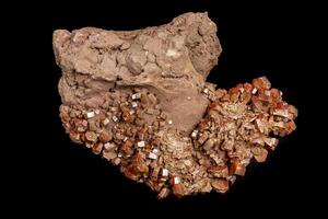 Macro mineral stone Vanadinite on a black background photo