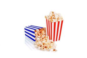 Glass with popcorn on a white background photo