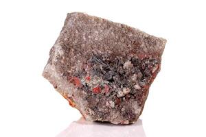 Macro stone Cinnabar with mineral stibnite on a white background photo