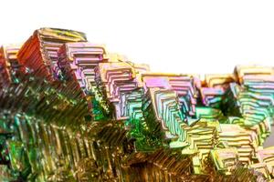 Macro of the mineral bismuth stone on a white background photo