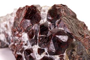 Macro stone garnet mineral on white background photo