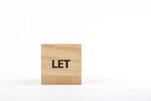 Wooden cubes with the inscription let on a white background photo