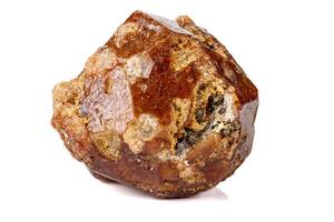 Macro stone Grossular mineral on white background photo