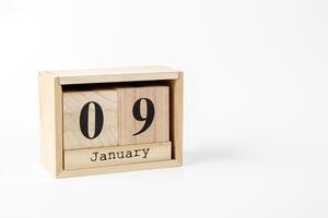 de madera calendario enero 09 en un blanco antecedentes foto