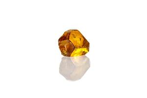 Macro yellow diamond mineral stone on white background photo