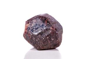 Macro of a mineral garnet stone on a white background photo