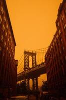 Brooklyn Bridge in orange wildfire fog photo
