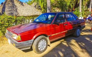 Puerto Escondido Oaxaca Mexico 2023 Red modern car vehicle transportation in the city town Mexico. photo