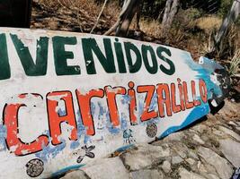 Puerto Escondido Oaxaca Mexico 2023 Advertising sign on surfboard Beach Playa Carrizalillo Puerto Escondido Mexico. photo