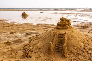 Temple of sand like a sandcastle Bentota Beach Sri Lanka. photo