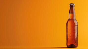 Single beer bottle with condensation against a vibrant orange background photo