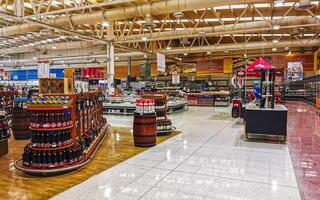 Playa del Carmen Quintana Roo Mexico 2021 Supermarket from the inside Shelves Goods People Shopping carts Products. photo