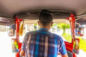 Bentota Beach Galle Sri Lanka 2018 Red Rickshaw Tuk Tuk cab vehicle Bentota Beach Sri Lanka. photo