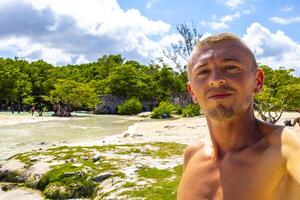 Male tourist Travelling man taking selfie Playa del Carmen Mexico. photo