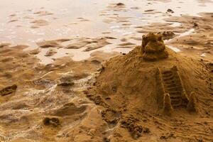 Temple of sand like a sandcastle Bentota Beach Sri Lanka. photo