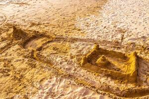 Temple of sand like a sandcastle Bentota Beach Sri Lanka. photo