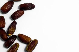 Dates fruit on isolated white background and copy space photo