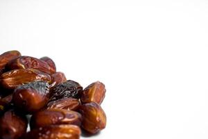 Dates fruit on isolated white background and copy space photo