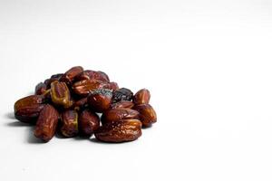 Dates fruit on isolated white background and copy space photo