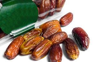Dates fruit in plastick package with blank green label for product mockup design, dates product isolated white background photo
