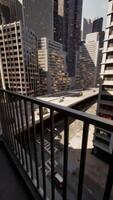 bustling cityscape captured from a balcony with a view of the streets below video