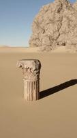 A stone pillar in the middle of a desert video