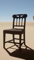 A chair sitting in the middle of a desert video