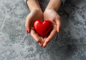 Person Holding Red Heart photo