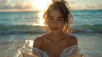 Woman in Straw Hat Reading Book on Beach photo