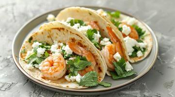 Plate of Shrimp Tacos With Feta Cheese and Cilantro photo