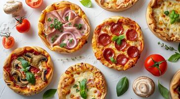 Group of Pizzas Arranged on White Surface photo