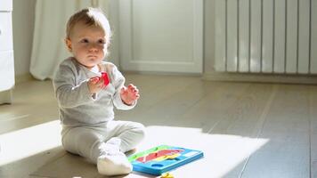 Little girl playing with educational toy. Cute girl playing intellectual toys video